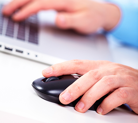 Hand clicking a computer mouse